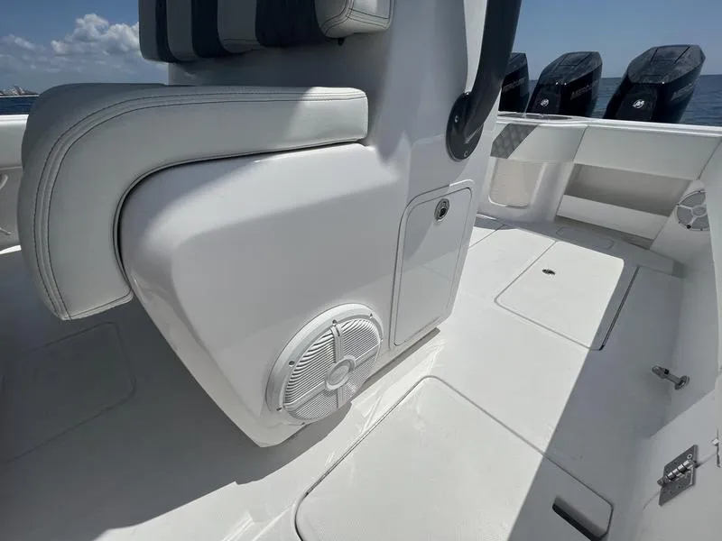 Slide: The Image of 2024 Invincible 43 Open Fisherman boat interior with seating and speaker detail. - 13
