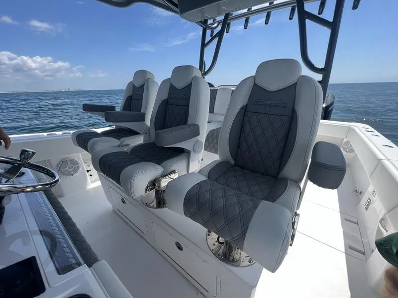 Slide: The Image of 2024 Invincible 43 Open Fisherman boat with luxurious seating on open water. - 14