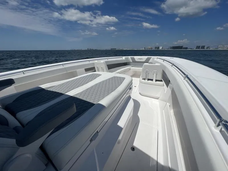 Slide: The Image of 2024 Invincible 43 Open Fisherman boat on open water under a clear sky. - 18