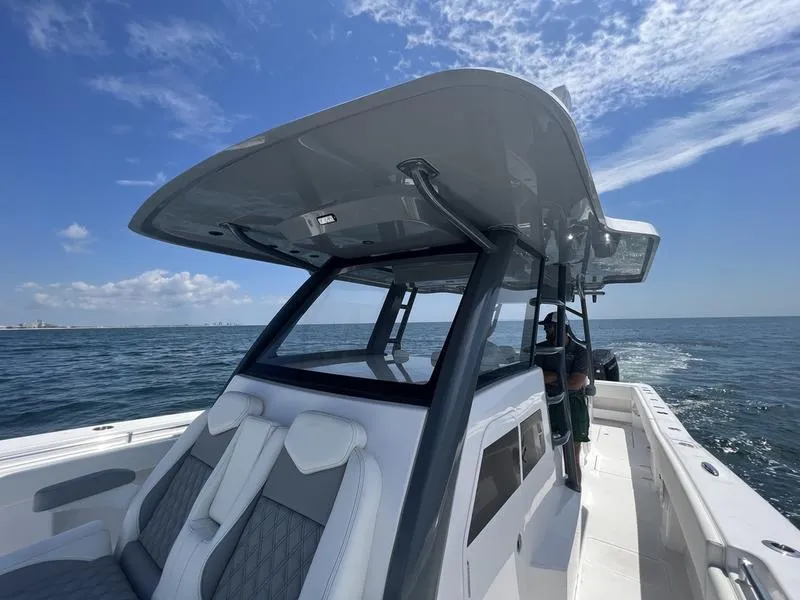 Slide: The Image of 2024 Invincible 43 Open Fisherman boat on open water under clear sky. - 22