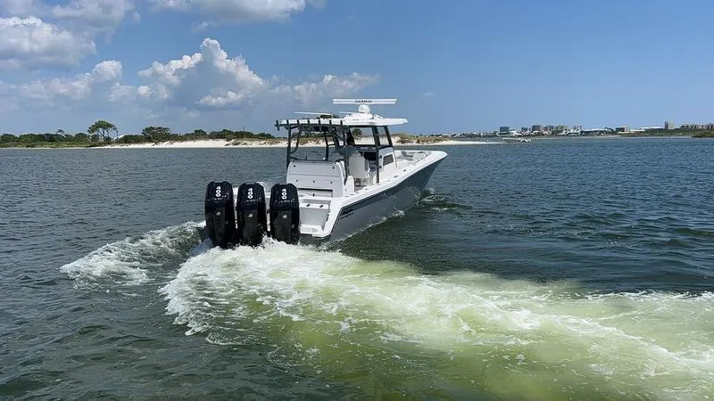 Slide: The Image of 2024 Invincible 43 Open Fisherman boat cruising on a sunny day. - 3