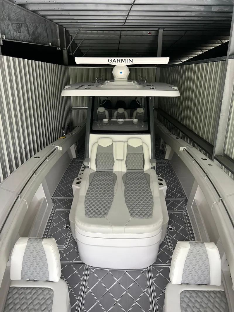 Slide: The Image of 2024 Invincible 43 Open Fisherman boat with Garmin equipment, featuring spacious seating and modern design. - 31