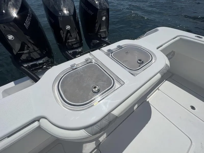 Slide: The Image of 2024 Invincible 43 Open Fisherman boat with Mercury engines, featuring dual livewells. - 8