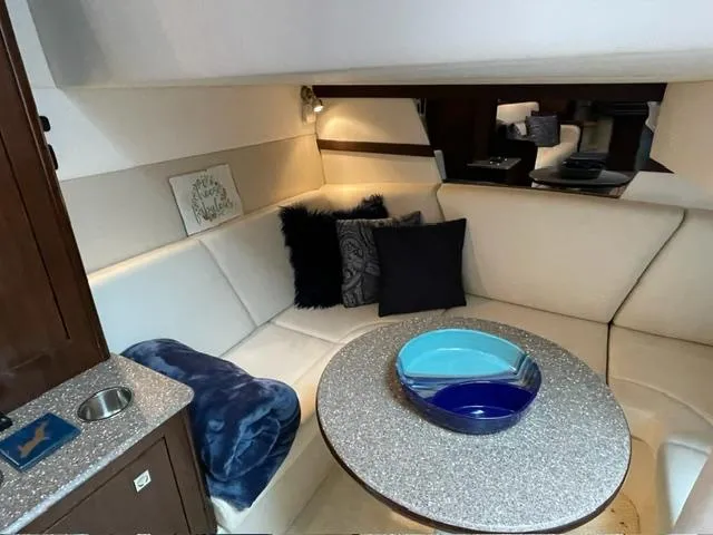 Slide: The Image of Interior of 2012 Cruisers Yachts 380 Express with cozy seating and modern decor. - 12