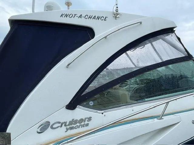 Slide: The Image of 2012 Cruisers Yachts 380 Express with "Knot-A-Chance" name on the side. - 17