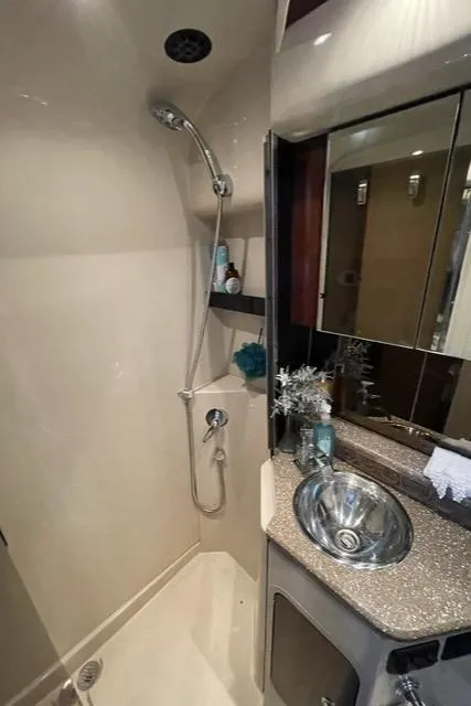 Slide: The Image of 2012 Cruisers Yachts 380 Express bathroom with shower and modern sink. - 20