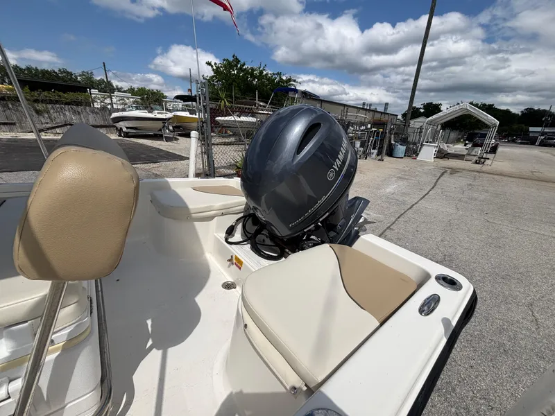 Slide: The Image of 2018 Key West 1720 Sportsman boat with Yamaha outboard motor in a marina setting. - 10