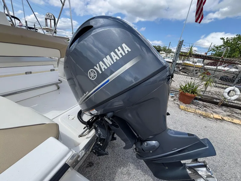 Slide: The Image of 2018 Key West 1720 Sportsman with Yamaha outboard motor, docked outdoors. - 13