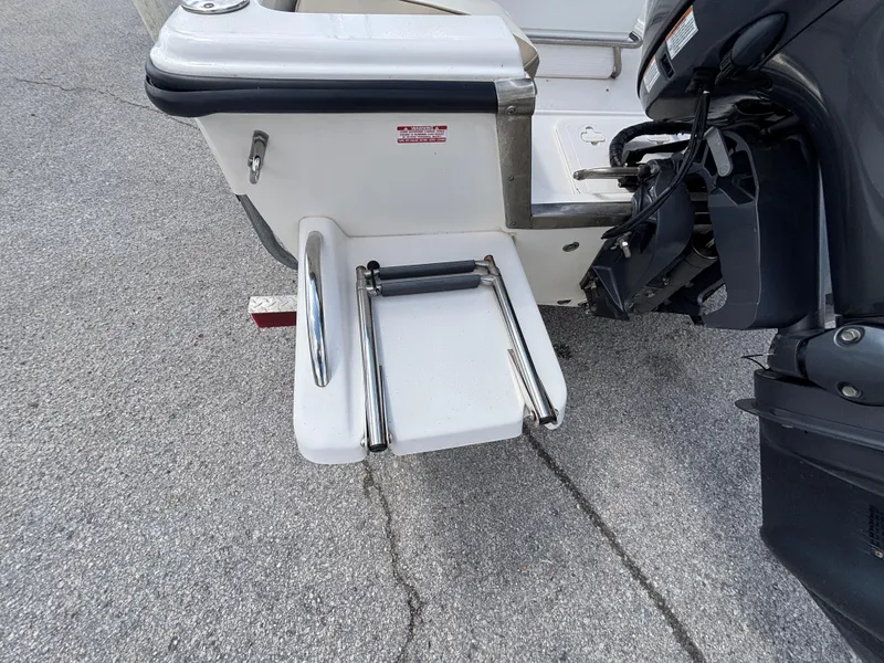 Slide: The Image of 2018 Key West 1720 Sportsman boat with foldable swim ladder and outboard motor. - 16