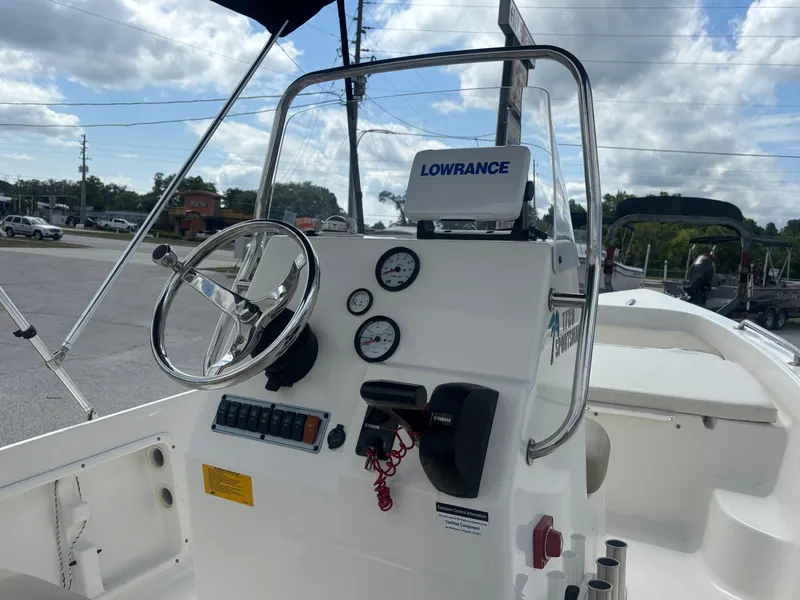 Slide: The Image of 2018 Key West 1720 Sportsman boat console with steering wheel and Lowrance navigation system. - 19