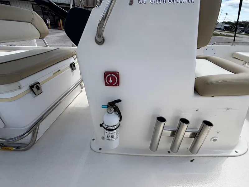 Slide: The Image of 2018 Key West 1720 Sportsman boat interior with fire extinguisher and rod holders. - 24