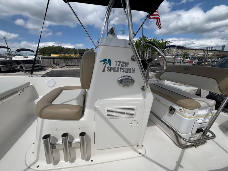 Slide: The Image of 2018 Key West 1720 Sportsman boat interior with seating and steering console. - 8