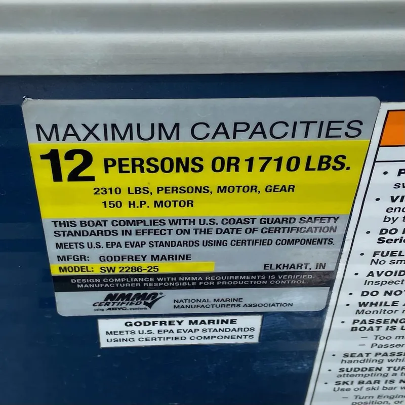 Slide: The Image of Capacity label for 2021 Godfrey Sweetwater 2286 SBX, 12 persons or 1710 lbs, 150 HP motor. - 5