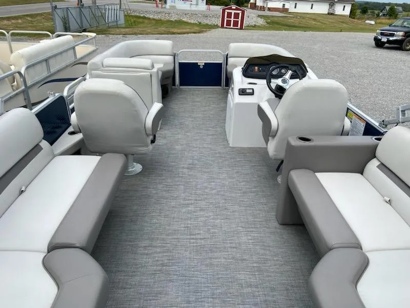 Slide: The Image of 2021 Godfrey Sweetwater 2286 SBX pontoon boat interior with gray seating and steering console. - 7