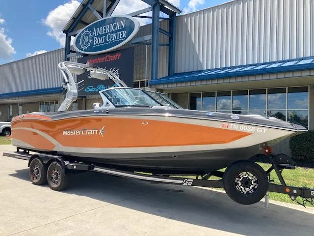 Slide: The Image of 2018 MasterCraft X26 boat on trailer at American Boat Center. - 0