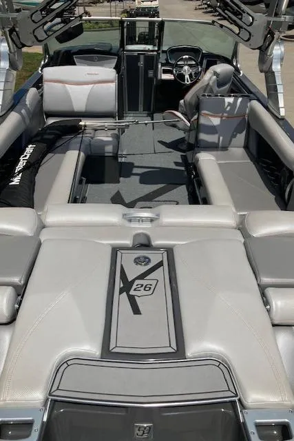 Slide: The Image of 2018 MasterCraft X26 boat interior with luxurious seating and modern design. - 7