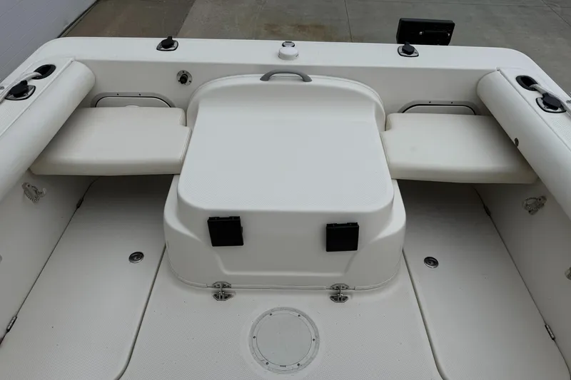 Slide: The Image of 2010 Trophy 2152 Walkaround boat interior with seating and storage compartments. - 11