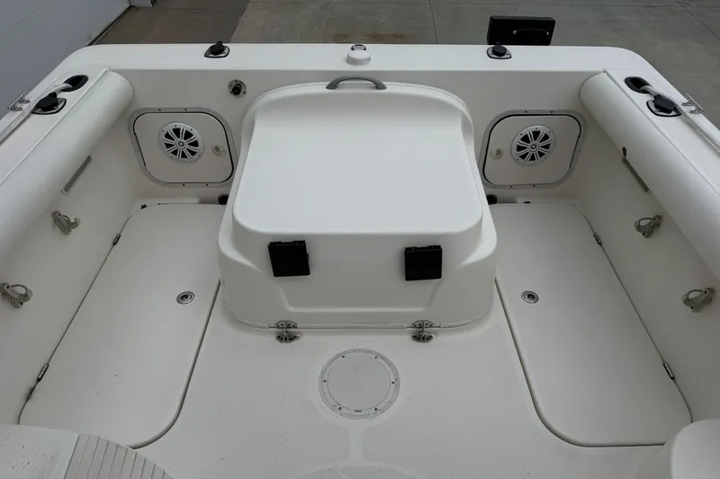 Slide: The Image of 2010 Trophy 2152 Walkaround boat interior with seating and storage compartments. - 12