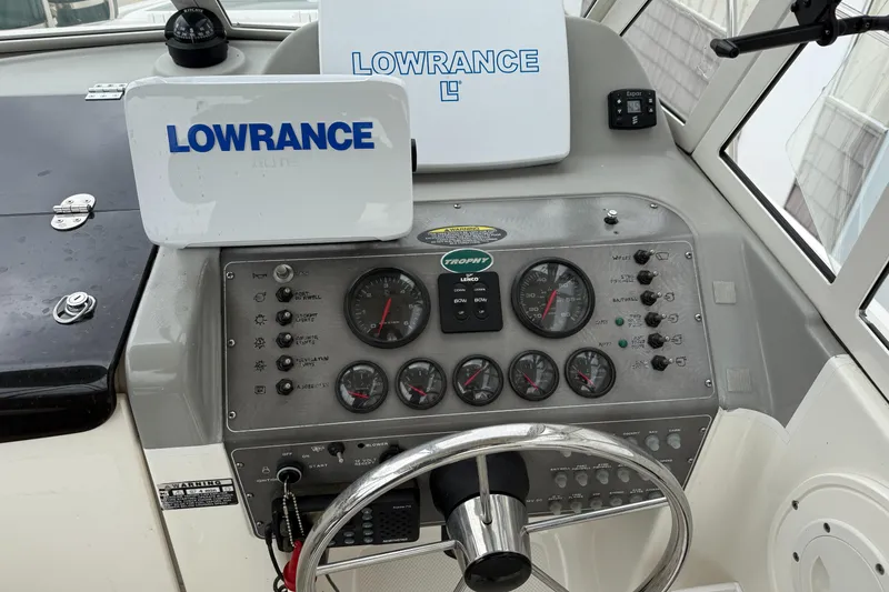 Slide: The Image of 2010 Trophy 2152 Walkaround boat dashboard with Lowrance navigation system and gauges. - 18