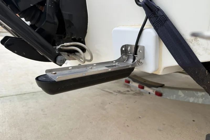 Slide: The Image of 2010 Trophy 2152 Walkaround boat transom with trim tab and trailer. - 28