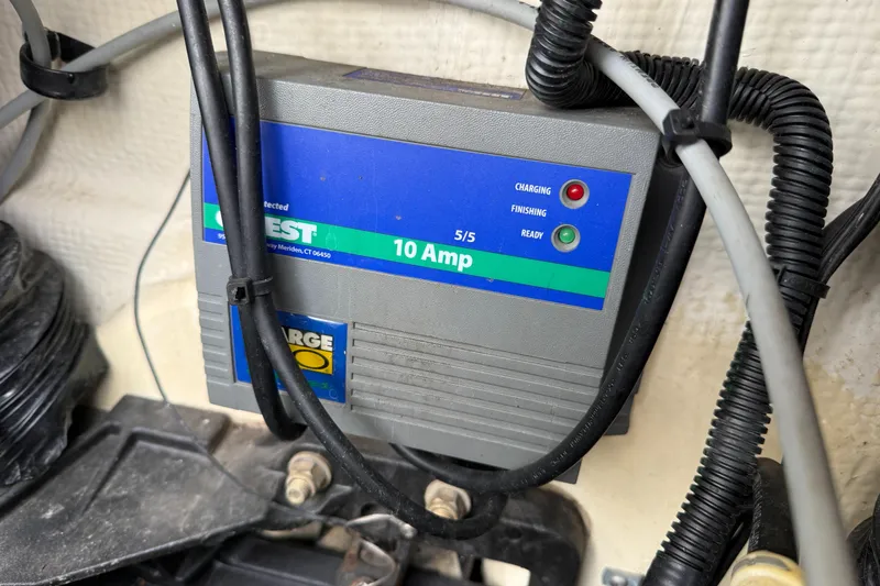 Slide: The Image of Battery charger in a 2010 Trophy 2152 Walkaround boat, showing 10 Amp capacity. - 29