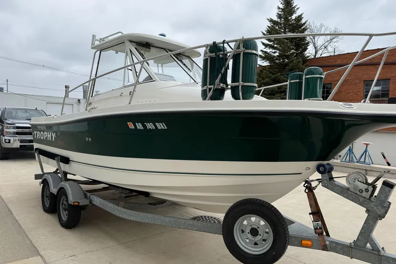 Slide: The Image of 2010 Trophy 2152 Walkaround boat on trailer, parked outdoors. - 3