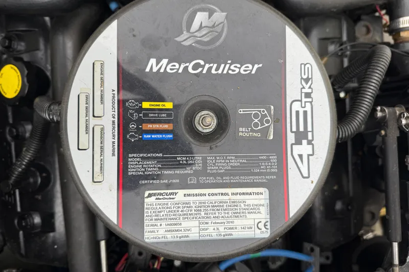 Slide: The Image of MerCruiser 4.3 TKS engine in 2010 Trophy 2152 Walkaround boat, showing specifications and belt routing. - 30