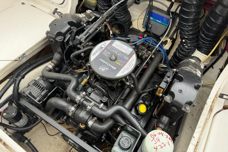 Slide: The Image of Engine compartment of a 2010 Trophy 2152 Walkaround boat, showcasing detailed mechanical components. - 31