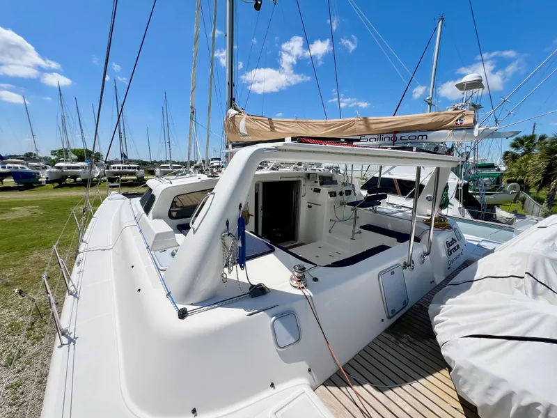 Slide: The Image of Voyage Yachts 500, 2010 model, docked with clear skies and surrounding boats. - 15