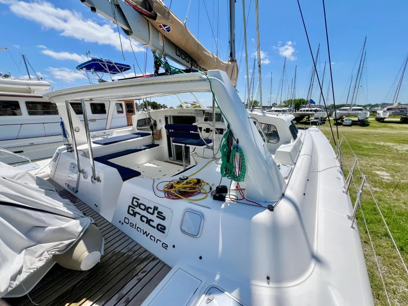 Slide: The Image of Voyage Yachts 500 sailboat, 2010 model, docked with clear skies and marina view. - 16