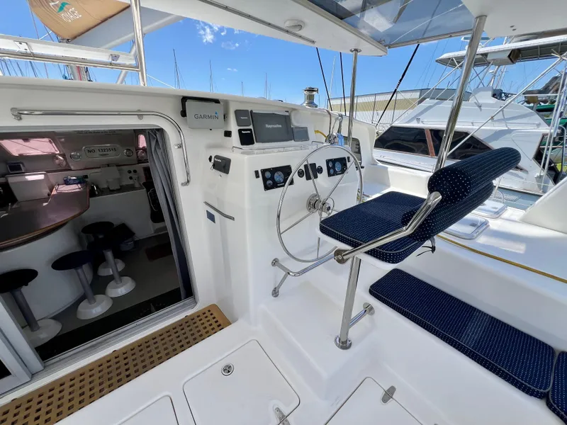 Slide: The Image of Helm of 2010 Voyage Yachts 500 with navigation equipment and seating, adjacent to cabin entrance. - 20