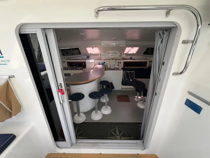 Slide: The Image of Interior view of 2010 Voyage Yachts 500, featuring a modern kitchen and seating area. - 25