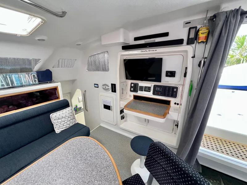 Slide: The Image of Interior of 2010 Voyage Yachts 500, featuring modern seating and entertainment system. - 28