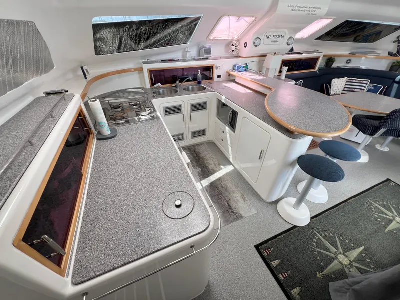 Slide: The Image of Spacious kitchen area in a 2010 Voyage Yachts 500, featuring modern countertops and seating. - 31