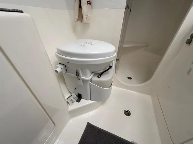 Slide: The Image of Compact bathroom with toilet in 2010 Voyage Yachts 500 model. - 44