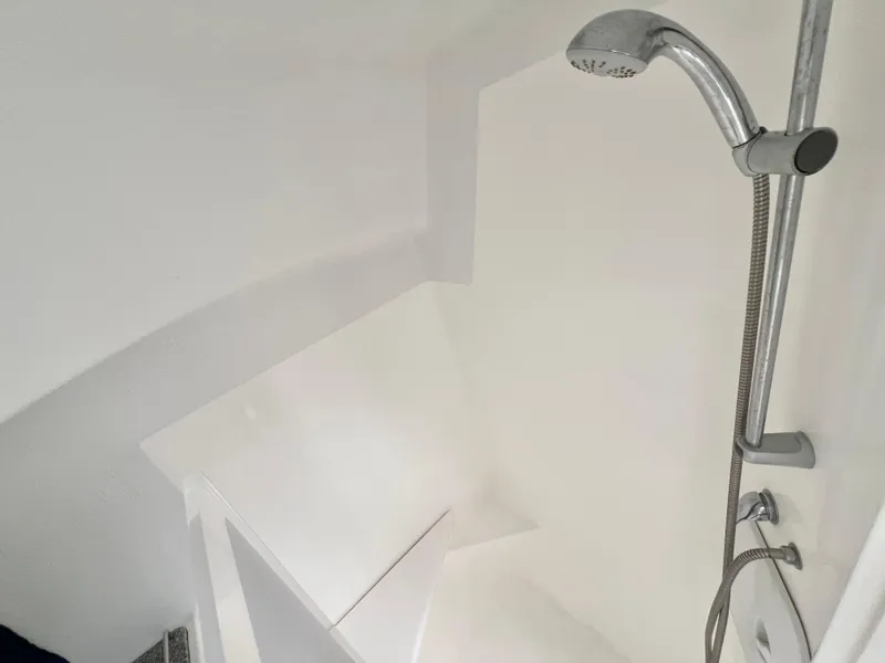 Slide: The Image of Shower area in 2010 Voyage Yachts 500, featuring sleek white design and modern fixtures. - 45