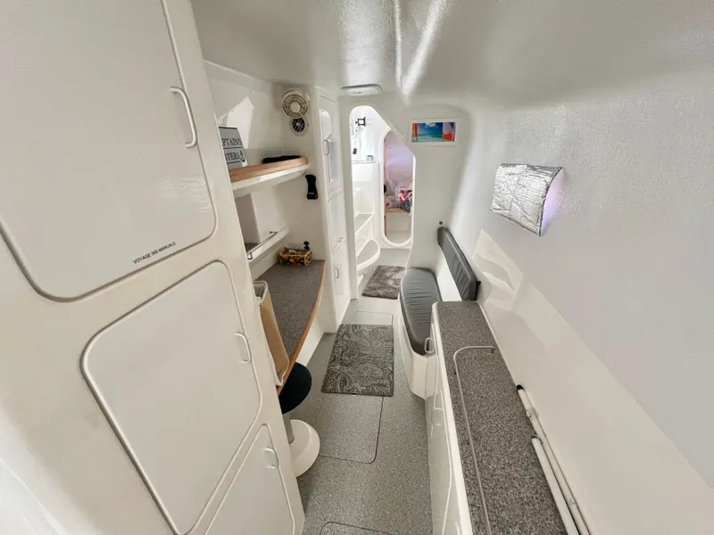 Slide: The Image of Interior of 2010 Voyage Yachts 500, featuring sleek white design and modern amenities. - 46