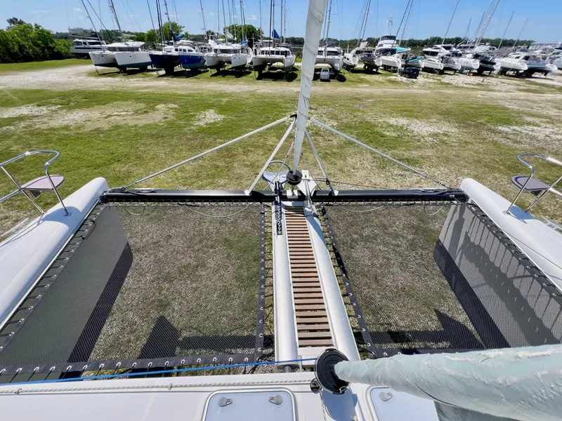 Slide: The Image of Catamaran deck view of 2010 Voyage Yachts 500, with marina in background. - 9