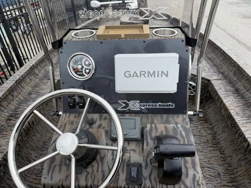 Slide: The Image of 2025 Xpress H22B Bay boat dashboard with Garmin navigation system. - 9