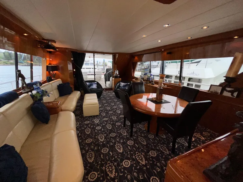 Slide: The Image of Luxurious 2001 Horizon Skylounge yacht interior with elegant seating and dining area. - 11