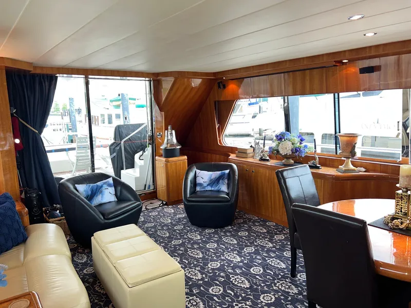 Slide: The Image of Luxurious 2001 Horizon Skylounge yacht interior with elegant seating, floral decor, and large windows. - 13