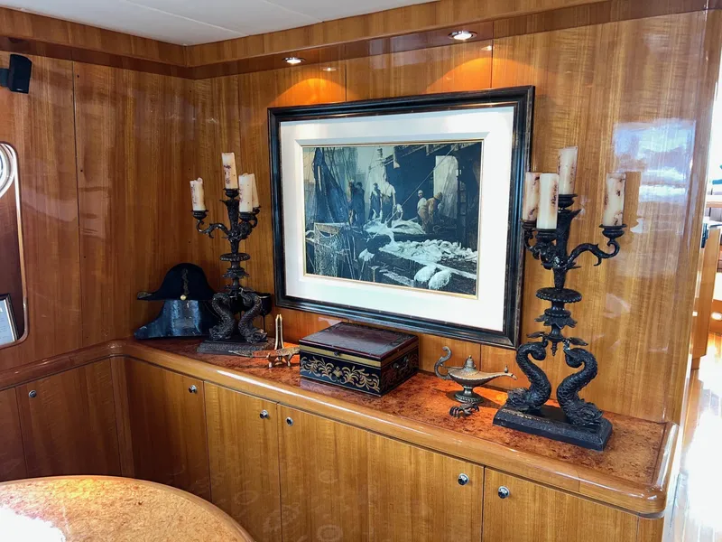 Slide: The Image of Luxurious yacht interior with elegant decor, featuring framed artwork and ornate candle holders. Horizon Skylounge 2001. - 14