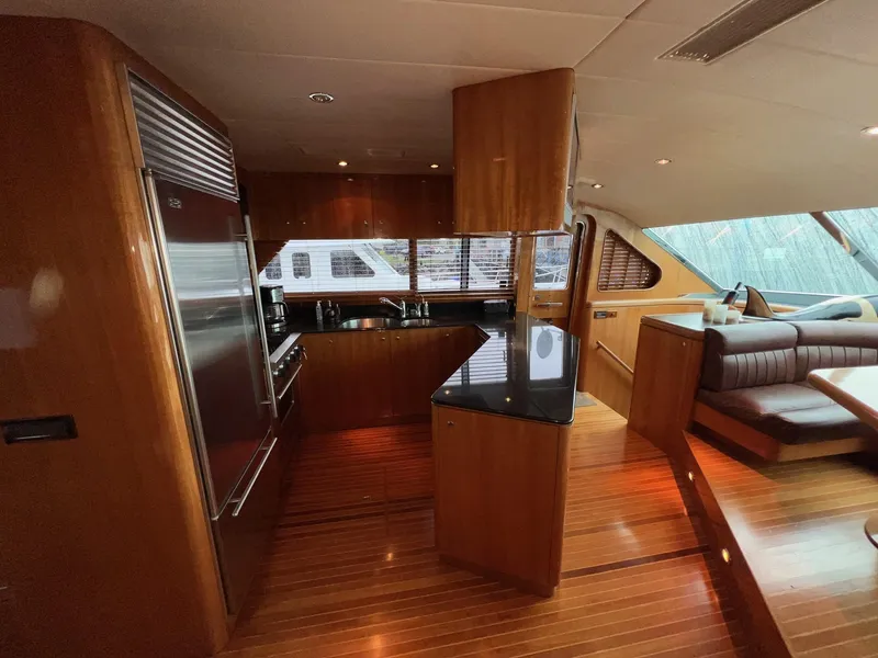 Slide: The Image of Luxurious 2001 Horizon Skylounge yacht interior with modern kitchen and seating area. - 19