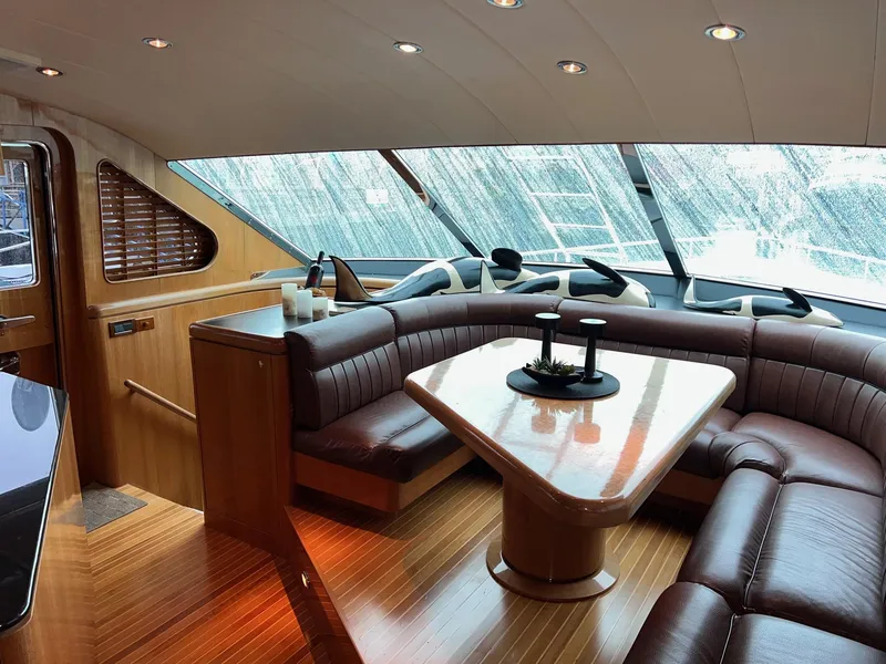 Slide: The Image of Luxurious interior of a 2001 Horizon Skylounge yacht with elegant seating and wooden finishes. - 25