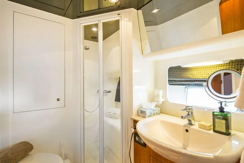 Slide: The Image of Luxurious bathroom in 2001 Horizon Skylounge yacht with modern fixtures and elegant design. - 31