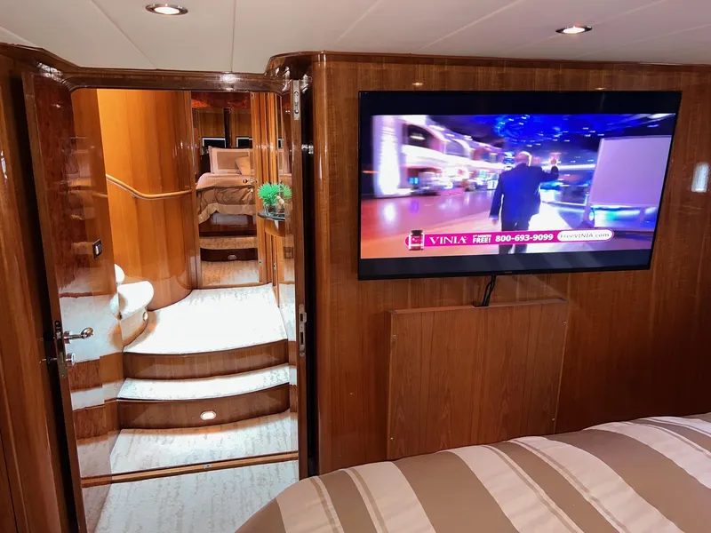 Slide: The Image of Luxurious 2001 Horizon Skylounge interior with TV, wooden finishes, and staircase. - 41