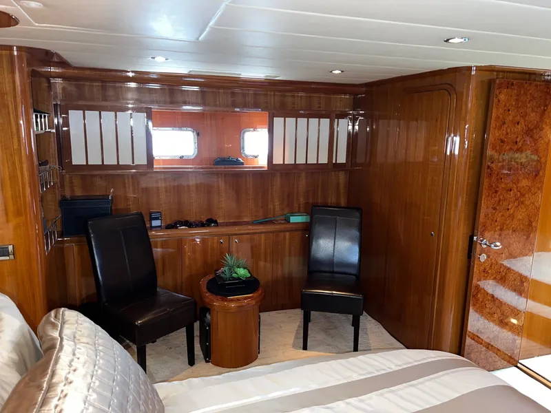 Slide: The Image of Luxurious cabin interior of 2001 Horizon Skylounge yacht with wooden paneling and elegant seating. - 45