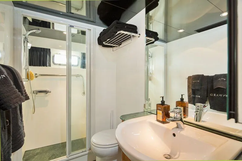 Slide: The Image of Luxurious bathroom in 2001 Horizon Skylounge yacht with modern fixtures and elegant design. - 46
