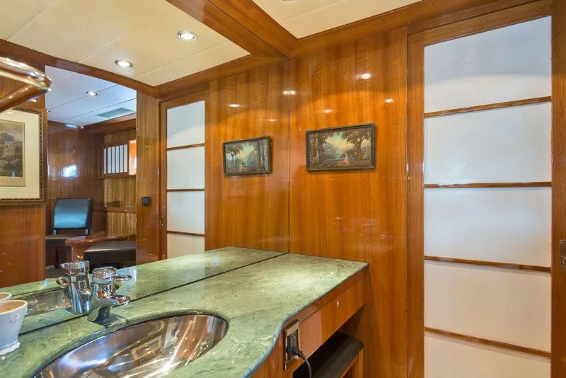 Slide: The Image of Luxurious yacht interior with wooden paneling, green countertop, and modern fixtures, Horizon Skylounge 2001. - 47