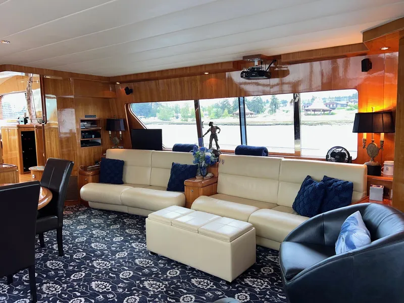 Slide: The Image of Luxurious 2001 Horizon Skylounge yacht interior with elegant seating and scenic window views. - 8